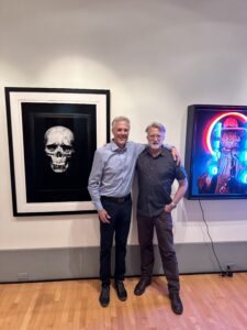Jeff Puckett and Michael Blessing in front of their artworks